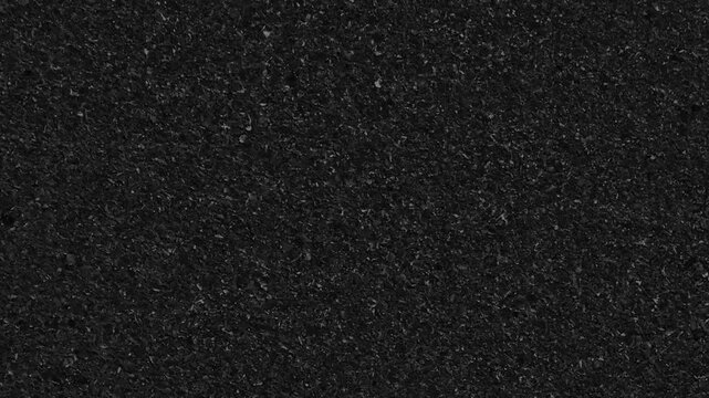Black Noise Grain Texture Loop.Seamless loop of a dark, grainy, noise texture. This gritty, abstract background is perfect for overlays, static effects, or minimalist backdrops
