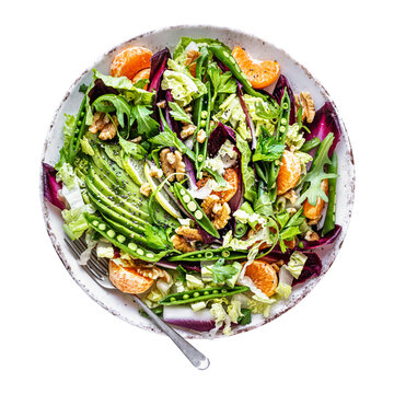 Vibrant and fresh salad bursting with greens avocado oranges and nuts offering a delicious and nutritious meal option