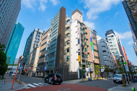 Modern commercial building on Hanatsubaki dori Street at Tokyo Metropolitan Road Route 430 near Ginza Seven in district of Chuo, Tokyo, Japan. 