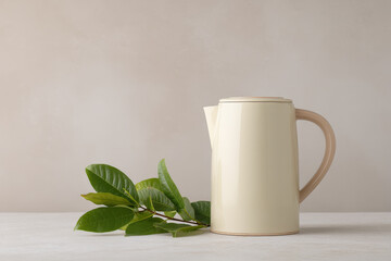 sleek electric kettle with digital thermometer displaying optimal tea brewing temperature