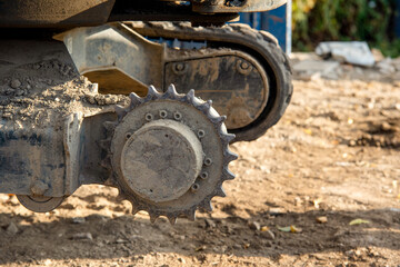Close-up of excavator lost broken track and waiting for repair