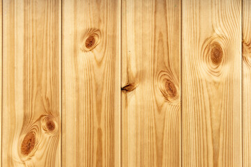 Obraz premium Close-up of wooden wall or floor made from plain planks showing nice natural wood grain and big knots