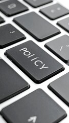 Close-up of a keyboard, with the "POLICY" key in focus