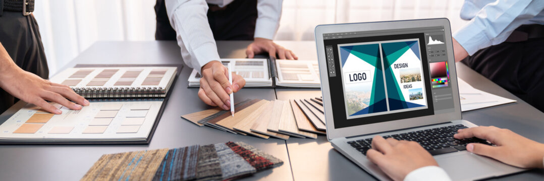 Graphic designer software for modern design of web page and commercial brisk ads showing on the computer screen - Powered by Adobe