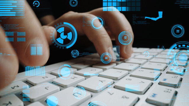 A close-up view of hands typing on a keyboard with an overlay of futuristic digital graphics, illustrating a seamless blend of technology and communication in a modern workspace. Xenic