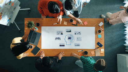 A diverse group of professionals engages in a brainstorming session focused on artificial intelligence topics, surrounded by modern office tools and collaborative elements. Trope