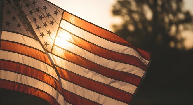 Closeup of the american flag waving in the wind with the sun shining through, creating a patriotic and symbolic image of freedom and unity