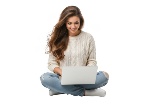 Young woman wearing headphones and a cozy sweater sitting cross legged with a laptop smiling isolated on transparent background - Powered by Adobe