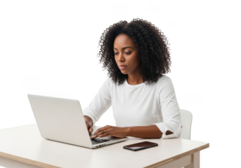 Young african american woman typing on a white laptop computer while sitting at a desk isolated on transparent background