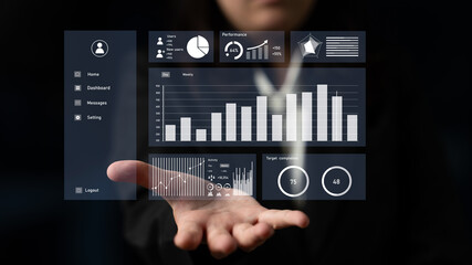A business professional showcases a transparent digital dashboard featuring data visualizations and performance metrics in a modern office setting. Impute