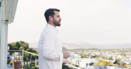 Obraz premium Man, thinking and balcony with coffee for morning start, fresh air or view in neighborhood. Thoughtful, male person or drinking with cup, mug or caffeine beverage on terrace for vision on space