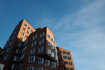 A dramatic, low-angle shot of the unique, modern architecture in D&uuml;sseldorf, Germany's Media Harbour (MedienHafen).