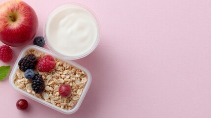 Healthy School Meals, a vibrant lunch box featuring yogurt, a cereal bar, an apple, and a berry oatmeal cocktail against a pink backdrop, promoting nutritious choices for students.