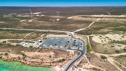 Aerial view of Coral Bay and beach in Western Australia with turquoise ocean and white sand
