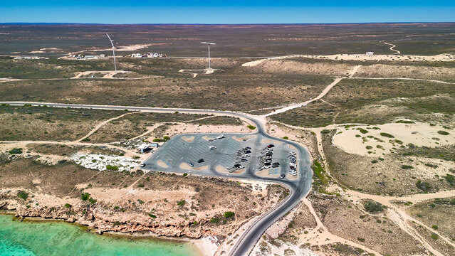 Aerial view of Coral Bay and beach in Western Australia with turquoise ocean and white sand
