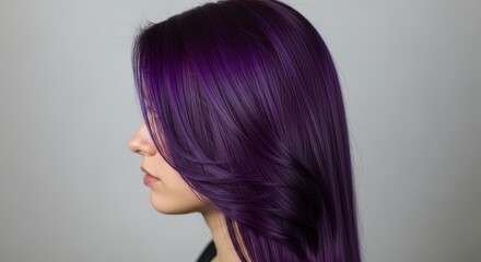 Young caucasian female with vibrant purple hair in profile view