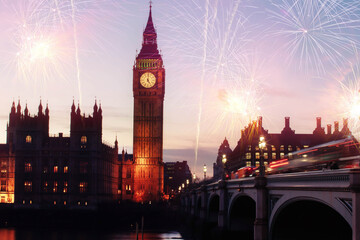 Fototapeta premium Explosive fireworks display fills the sky around Big Ben. New Year's Eve celebration background