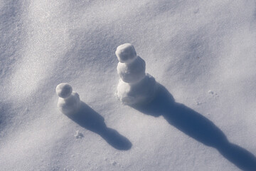 Snowman with winter hat and scarf outdoors. Snowman in winter landscape. Snowman with snowball fun outdoors. Snowman for winter seasonal poster design.