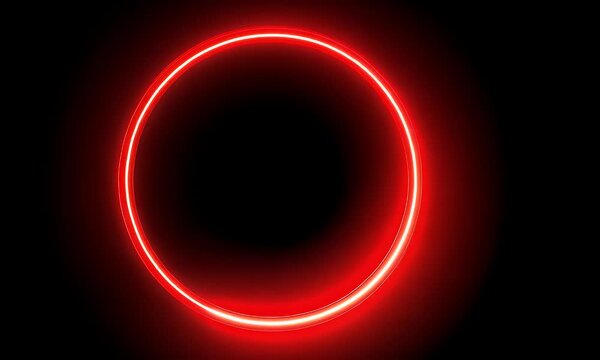Vibrant glowing red neon circle emitting a bright light against a deep black background creating a futuristic and abstract visual effect with a sense of energy and focus