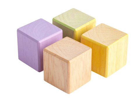 Four pastel-painted wooden cubes nested in a square shape