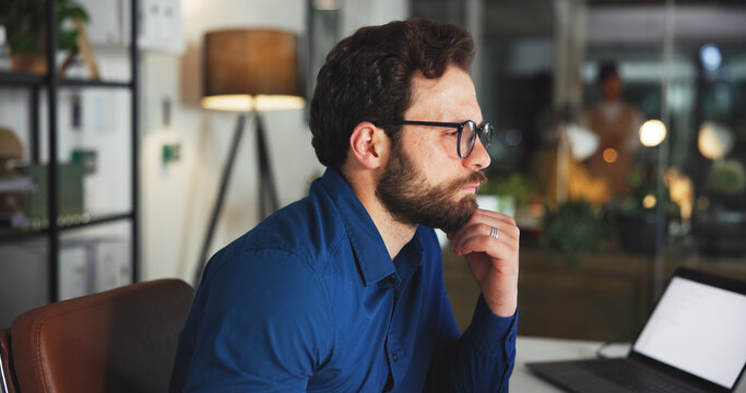 Online, thinking and glasses with business man in office for marketing campaign, night and news vision. Digital branding, reflection and bokeh with employee in media agency for article deadline