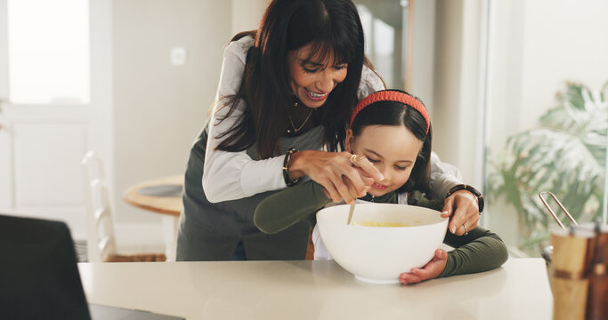 Baking, mother or girl with mixing bowl on kitchen counter, meal prep or help with dessert in family home. Learning, laptop and happy woman with child to teaching cooking skills, guidance or support