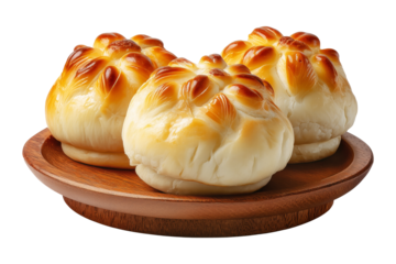 Panipopo sweet rolls baked in coconut milk with golden crust on wooden plate isolated on white transparent background, concept of bakery and food freshness