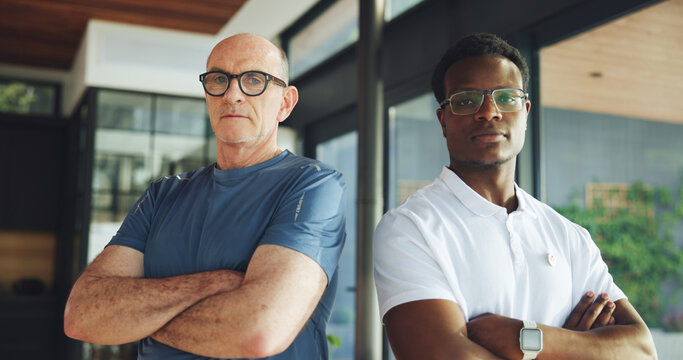 Arms crossed, physiotherapist and portrait of old man in office for support, chiropractor and rehabilitation. Consulting, physical therapy and recovery with senior patient in clinic for healthcare