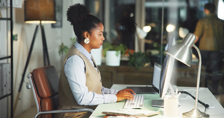 Business woman, typing and computer in office with journalist, ideas and deadline for story. Creative, reporter and person with tech for article, planning and overtime with inspiration at night
