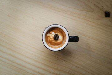 A clean, minimalist flat lay photograph of a single espresso shot