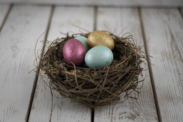 a nest with three glittering eggs