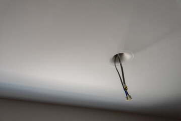 electrical wire setup for a light fixture out of a ceiling