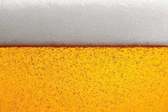 Close-up of beer, frothy head - Powered by Adobe
