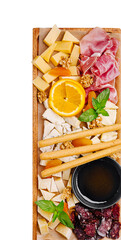 Delicious cheese and charcuterie board with fruit and nuts