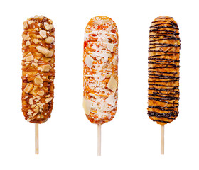 Three corn dogs with different toppings — nuts and caramel, coconut flakes and white chocolate, chocolate drizzle. Isolated on white background, street food concept.