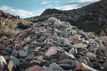 a meticulously stacked pile of weathered gray stones