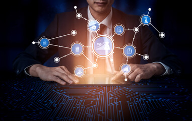 A businessman analyzes digital taxation data using modern technology. Icons depict various financial concepts, representing the intersection of technology and finance. Tessel