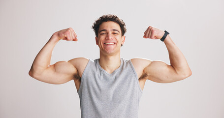 Portrait, man and flex bicep for fitness, strength and workout progress in studio. Smile, person...