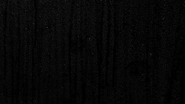 Abstract heavy rain overlay on black background with white falling water drops, vertical rain streaks, and a dramatic storm effect for motion graphics and visual design