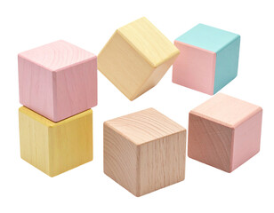 Obraz premium Soft-hued wooden cubes stacked haphazardly