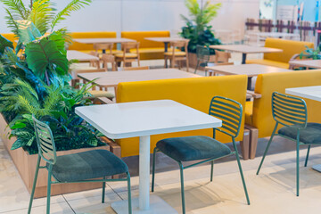 Tables and chairs in the restaurant room