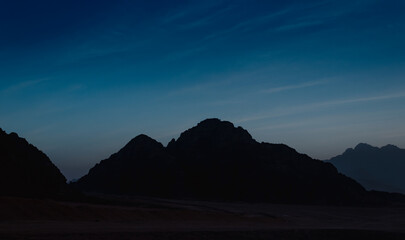 landscape rocky mountains and desert and sky at dawn in Egypt