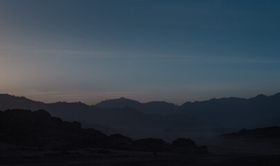 landscape rocky mountains and desert and sky at dawn in Egypt