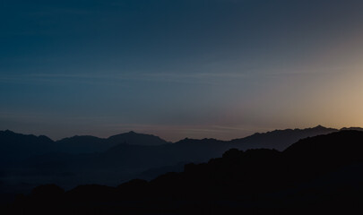landscape rocky mountains and desert and sky at dawn in Egypt