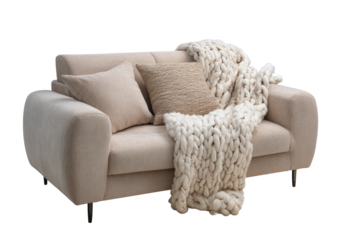 Beige loveseat with chunky knit throw and pillows