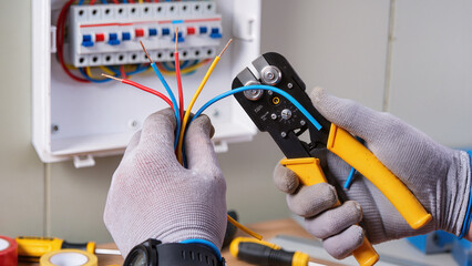 electrician fixing electrical outlet