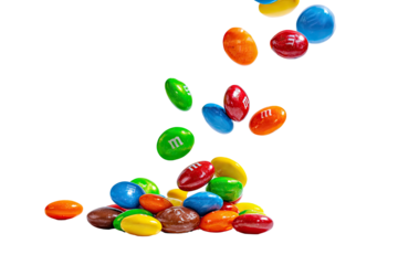 Colorful candy-coated chocolates falling onto a pile