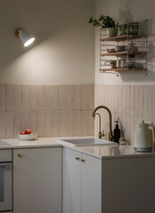 Cozy evening kitchen interior. Minimalistic Scandinavian design kitchen