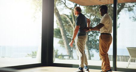 Senior man, consulting and physiotherapy at house with assistance for back pain relief. Physiotherapist, helping and elderly person for physical recovery, medical support and rehabilitation procedure