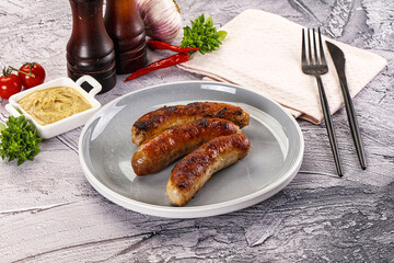Delicous natural roasted sausages in the plate